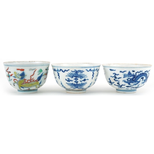 1430 - Three Chinese porcelain bowls including a blue and white example hand painted with stylised phoenixe... 