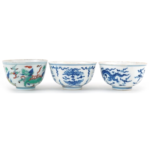 1430 - Three Chinese porcelain bowls including a blue and white example hand painted with stylised phoenixe... 