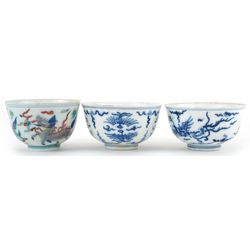 1430 - Three Chinese porcelain bowls including a blue and white example hand painted with stylised phoenixe... 