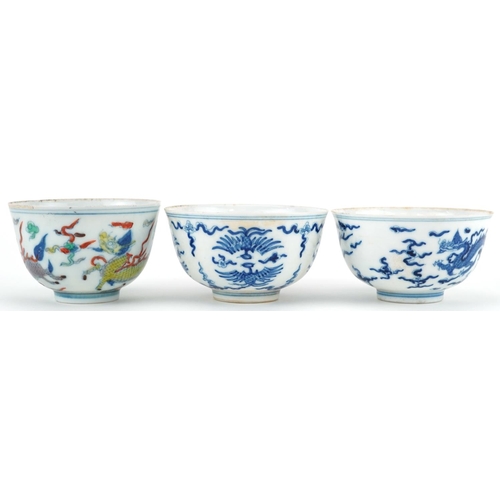 1430 - Three Chinese porcelain bowls including a blue and white example hand painted with stylised phoenixe... 