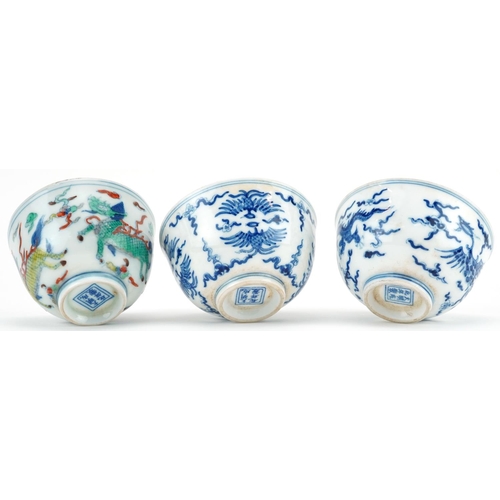 1430 - Three Chinese porcelain bowls including a blue and white example hand painted with stylised phoenixe... 