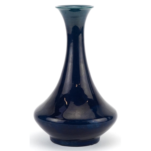 44 - Arts & Crafts vase having a blue lustre glaze, impressed mark to the base, possibly Chinese, 21cm hi... 