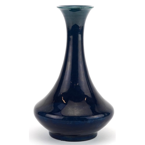 44 - Arts & Crafts vase having a blue lustre glaze, impressed mark to the base, possibly Chinese, 21cm hi... 