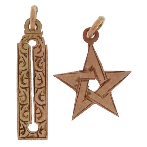 2696 - Two unmarked gold masonic charms, each tests as 9ct gold, the largest 1.8cm high, total 0.8g