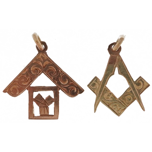 2478 - Two unmarked gold masonic charms, each tests as 9ct gold, the largest 1.4cm high, total 0.8g