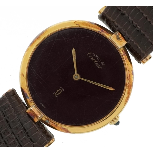 2063 - Cartier, ladies silver gilt Must de Cartier wristwatch having a burgundy dial with box and paperwork... 