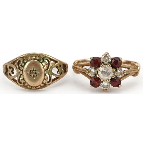 2663 - Two 9ct gold rings comprising garnet and clear stone cluster and a diamond solitaire, sizes H/I and ... 