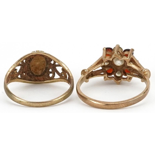 2663 - Two 9ct gold rings comprising garnet and clear stone cluster and a diamond solitaire, sizes H/I and ... 