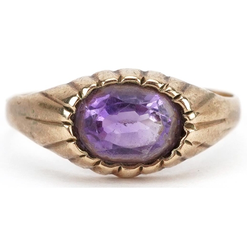 2524 - 9ct gold oval amethyst ring with ornate setting, size K, 2.0g