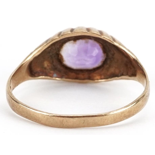 2524 - 9ct gold oval amethyst ring with ornate setting, size K, 2.0g