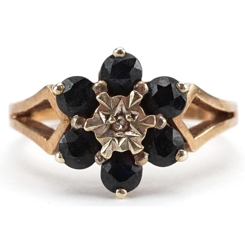 2268 - 9ct gold diamond and sapphire flower head ring with split shoulders, size K, 2.9g