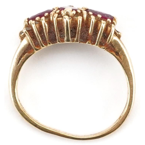 2282 - Gold ruby and diamond ccluster ring, indistinct marks to the band, the central ruby, approximately 5... 