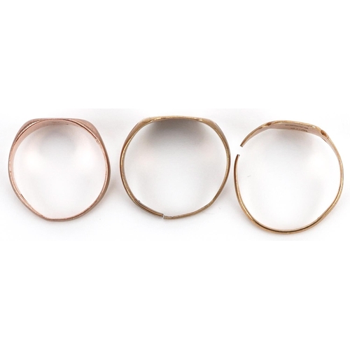 2706 - Three 9ct gold signet rings including one rose gold, total 5.4g