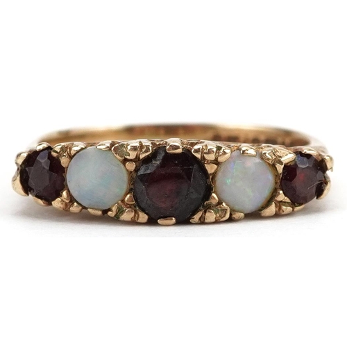 2181 - Victorian style 9ct gold graduated garnet and opal five stone ring with ornate setting, size I, 2.4g