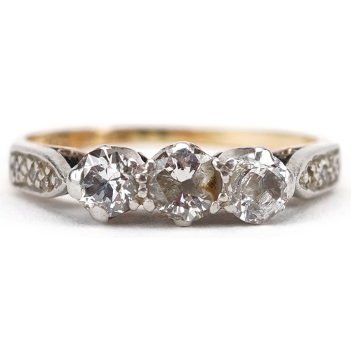 2047 - 18ct gold and platinum diamond three stone ring with diamond set shoulders, the central diamond appr... 