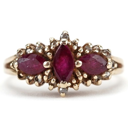 2282 - Gold ruby and diamond ccluster ring, indistinct marks to the band, the central ruby, approximately 5... 