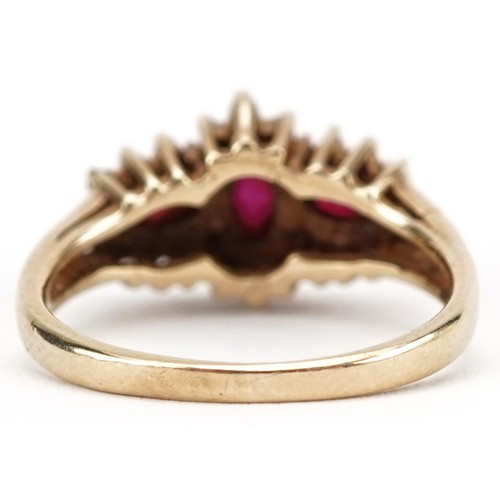 2282 - Gold ruby and diamond ccluster ring, indistinct marks to the band, the central ruby, approximately 5... 