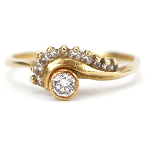 2071 - 18ct gold diamond crossover ring set with ten diamonds, the largest diamond approximately 2.60mm in ... 