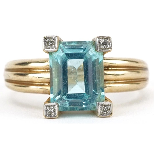 2467 - 9ct gold blue topaz and diamond ring, the topaz approximately 8.90mm x 7.0mm x 5.0mm deep, size L/M,... 