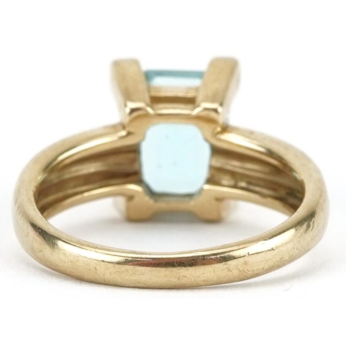 2467 - 9ct gold blue topaz and diamond ring, the topaz approximately 8.90mm x 7.0mm x 5.0mm deep, size L/M,... 