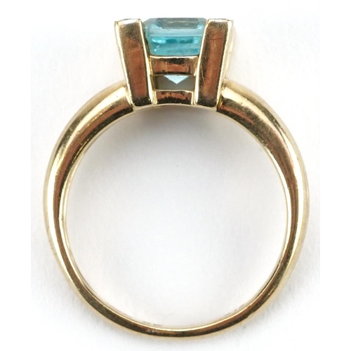 2467 - 9ct gold blue topaz and diamond ring, the topaz approximately 8.90mm x 7.0mm x 5.0mm deep, size L/M,... 