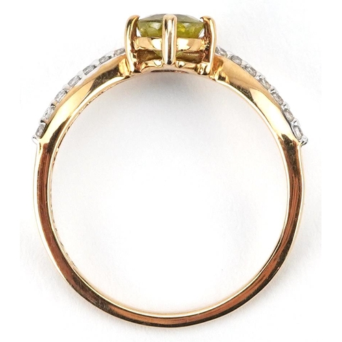 2080 - 10ct gold peridot and white spinel wishbone ring, size N, 1.9g