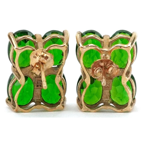 2619 - Pair of 9K gold green and clear stone flower head stud earrings, possibly olivine, 1.4cm high, 3.3g