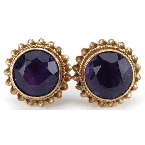 2074 - Pair of 9ct gold amethyst solitaire stud earrings, 11mm in diameter, 2.4g