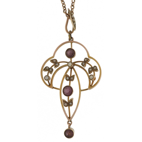 2126 - Edwardian 9ct gold garnet and seed pearl openwork pendant on a 9ct gold necklace, 5cm high and 42cm ... 