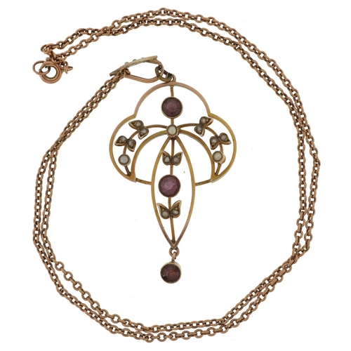 2126 - Edwardian 9ct gold garnet and seed pearl openwork pendant on a 9ct gold necklace, 5cm high and 42cm ... 