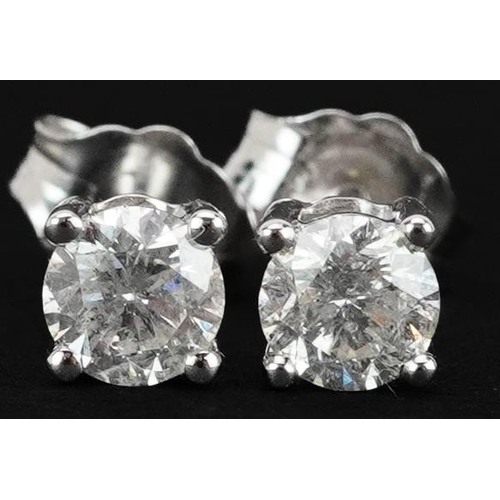 2493 - Pair of 9ct white gold diamond solitaire stud earrings, each diamond approximately 0.25 carat, 4.10m... 