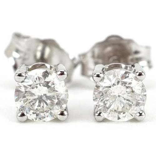 2493 - Pair of 9ct white gold diamond solitaire stud earrings, each diamond approximately 0.25 carat, 4.10m... 