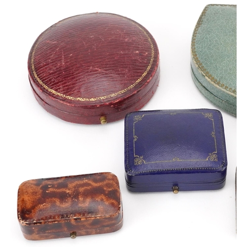 2754 - Eight 19th century and later jeweller's jewellery boxes, some tooled leather, including Horn & Peter... 