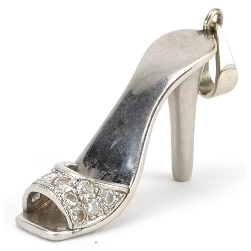 2038 - Unmarked white gold diamond charm in the form of a high heeled shoe, tests as 18ct gold, 3.5cm in le... 