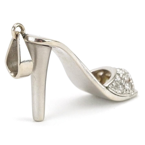 2038 - Unmarked white gold diamond charm in the form of a high heeled shoe, tests as 18ct gold, 3.5cm in le... 