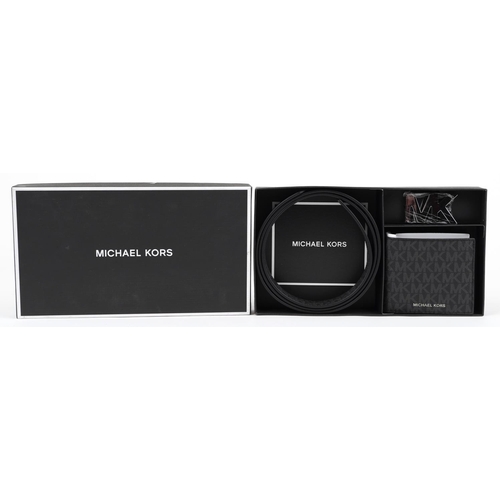 1284 - Gentlemen's Michael Kors as new gift set comprising monogrammed leather wallet and belt with box