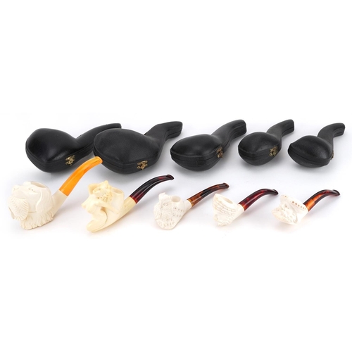 558 - Five smoking interest block Meerschaum pipes including examples with nude female and dog's head bowl... 