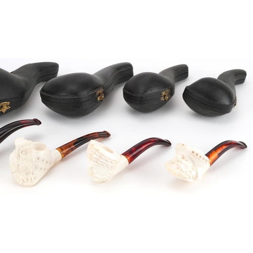 558 - Five smoking interest block Meerschaum pipes including examples with nude female and dog's head bowl... 