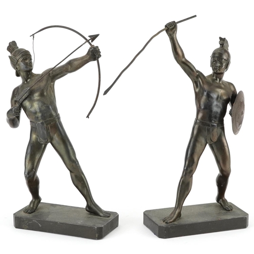 1423 - Pair of patinated spelter figures of a Greek archer and warrior, the largest 30cm high