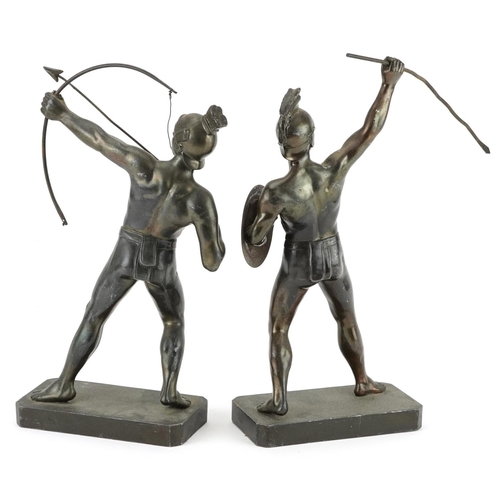 1423 - Pair of patinated spelter figures of a Greek archer and warrior, the largest 30cm high