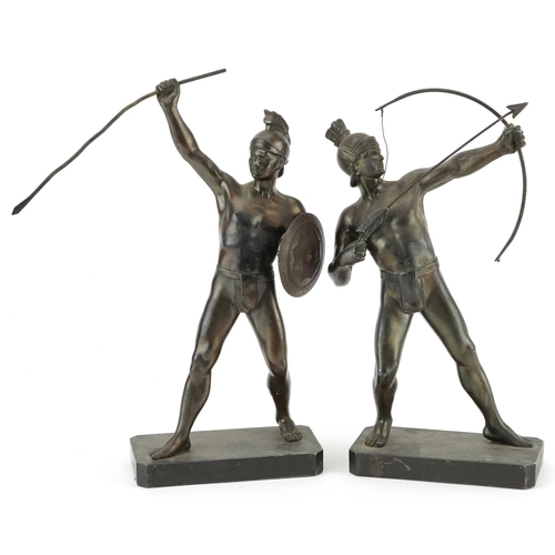 1423 - Pair of patinated spelter figures of a Greek archer and warrior, the largest 30cm high