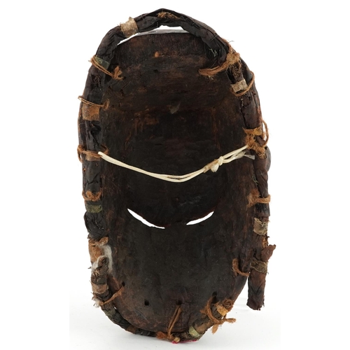 410 - African tribal interest lacquered carved hardwood face mask, 28cm high