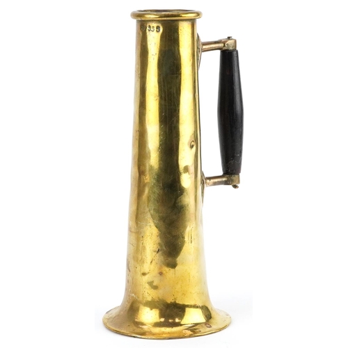 350 - Art Nouveau military interest trench art shell jug with ebonised handle impressed SP555, 29.5cm high