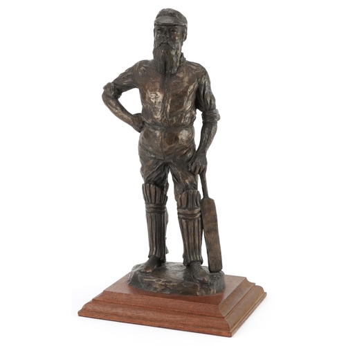 98 - Neil Godfrey, cold cast bronze statue of a cricketer raised on a square mahogany base, overall 39cm ... 