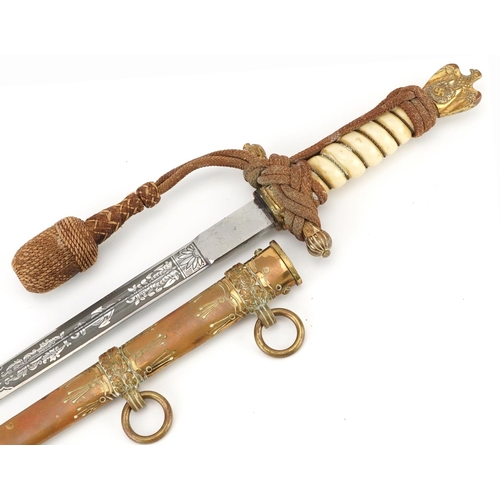 German military interest naval dagger with brass scabbard and steel blade engraved with foliate motifs and Clemen & Jung Solingen, 42cm in length