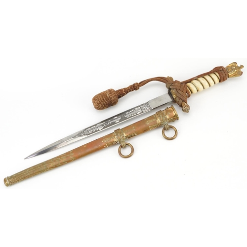 677 - German military interest naval dagger with brass scabbard and steel blade engraved with foliate moti... 