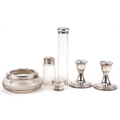 396 - Edwardian and later silver objects including a pair of dwarf candlesticks, silver mounted glass asht... 