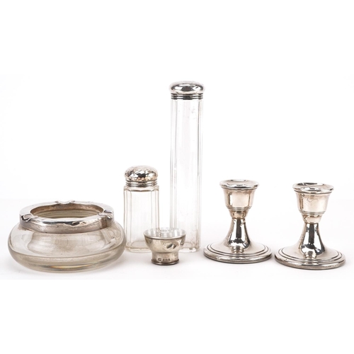 396 - Edwardian and later silver objects including a pair of dwarf candlesticks, silver mounted glass asht... 