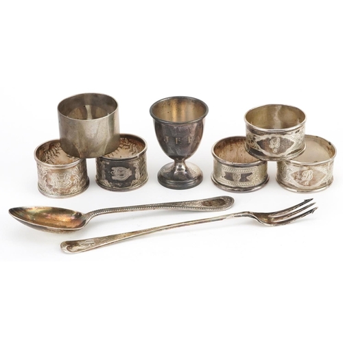 397 - Victorian and later silver comprising six napkin rings, eggcup, pickle fork and tablespoon, the larg... 