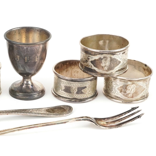 397 - Victorian and later silver comprising six napkin rings, eggcup, pickle fork and tablespoon, the larg... 